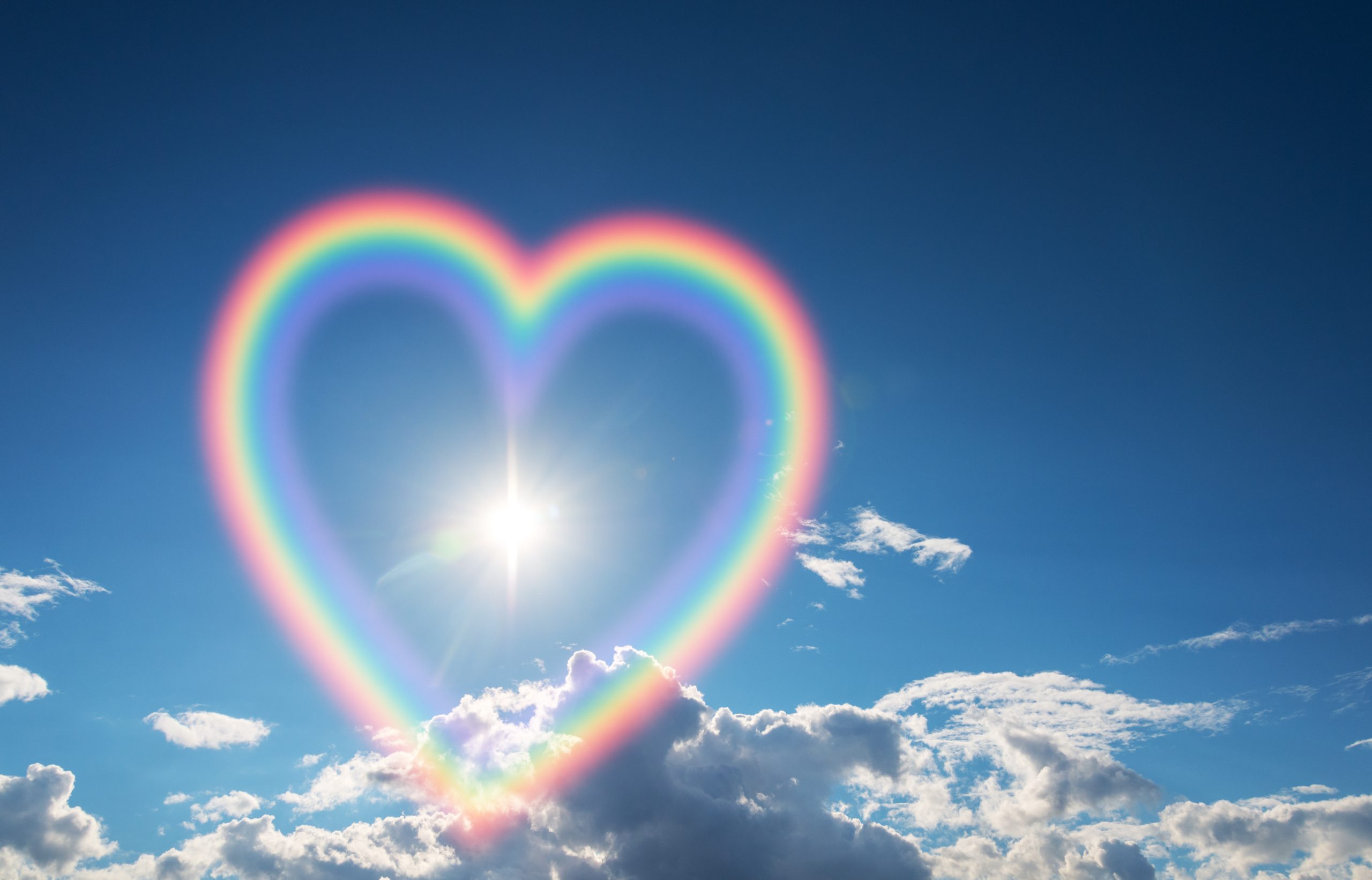 Heart shape rainbow in the sky.